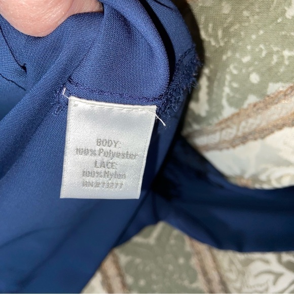 LAUREN Conrad classy navy blouse enhanced by lace shoulders and hidden buttons. - Picture 2 of 7